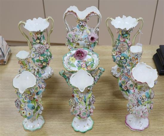 Eight English porcelain floral encrusted vases and a Coalbrookdale type two-handled jar and cover, all c.1830-40, tallest 30cm
